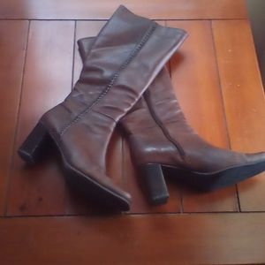 Brown leather boots .